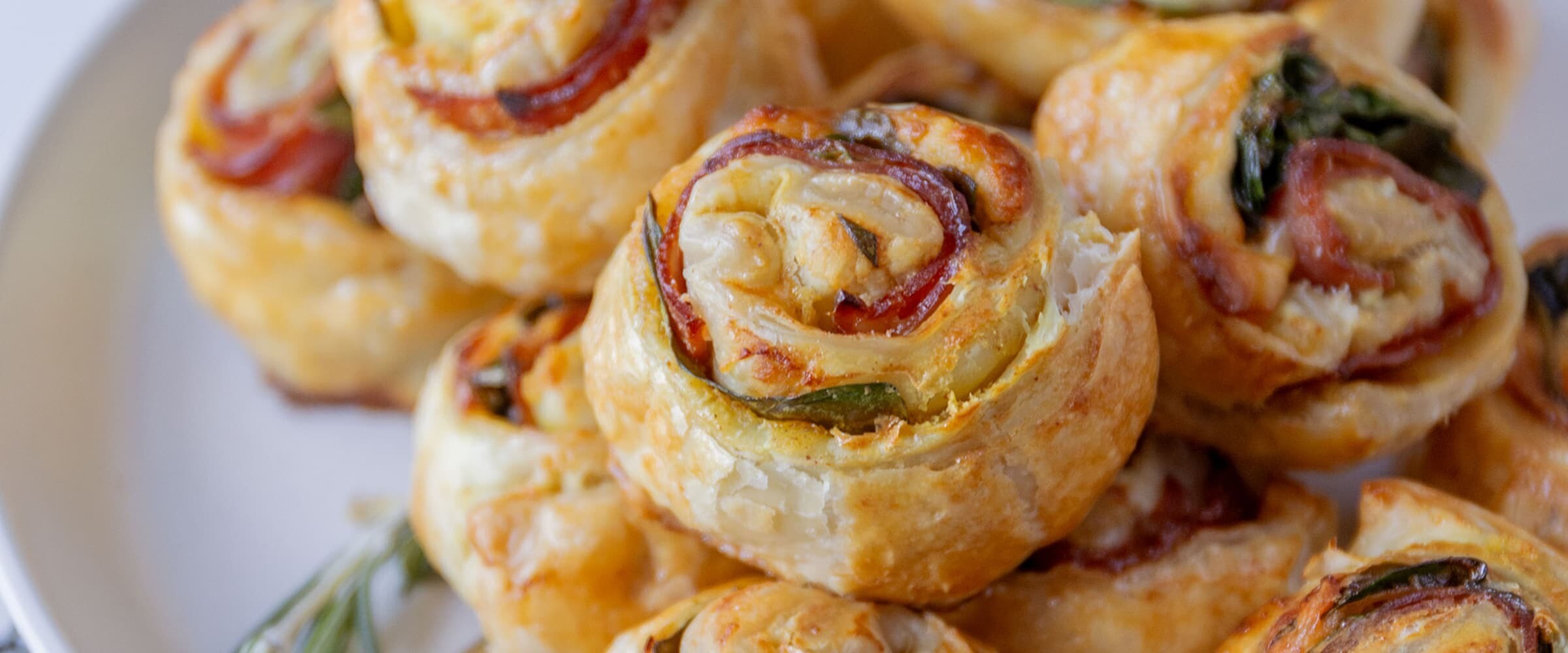 Close-up of ham and crescent roll dough pinwheel