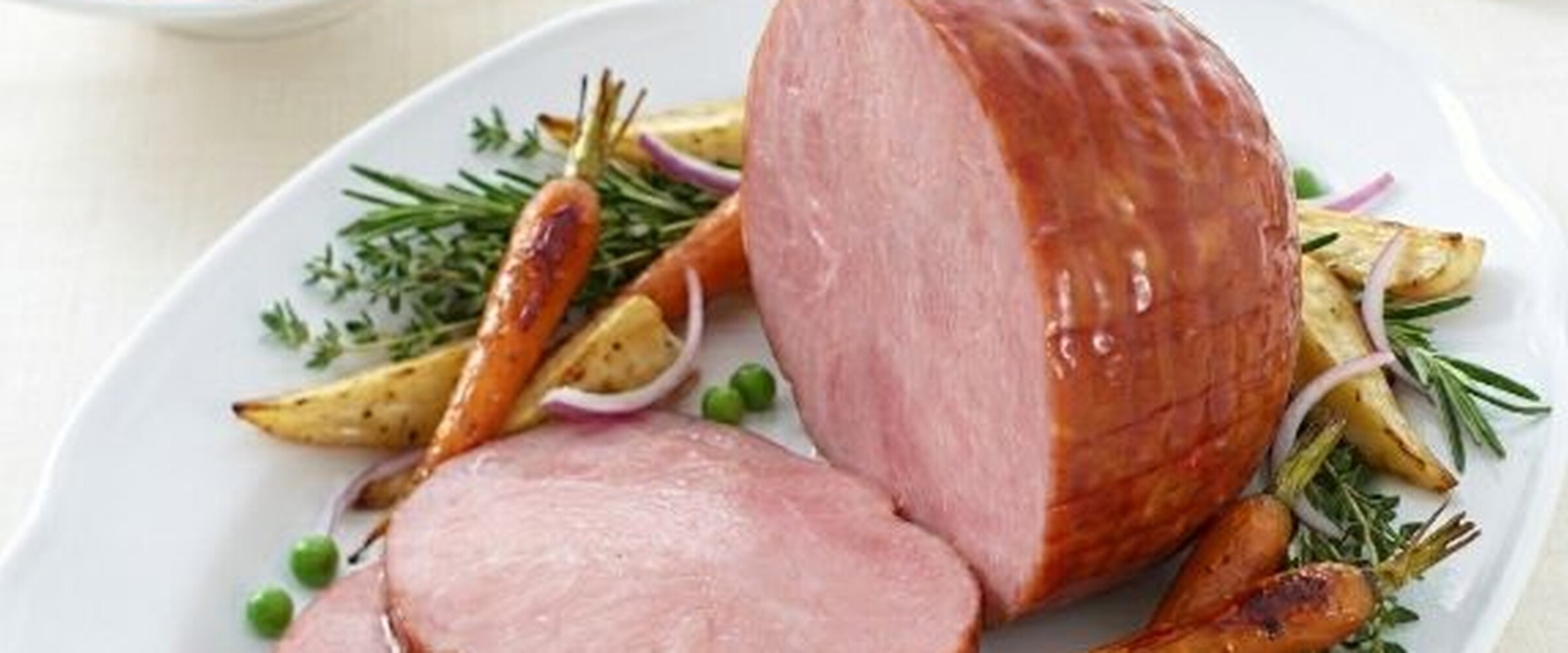 Close-up a dinner ham with carrots