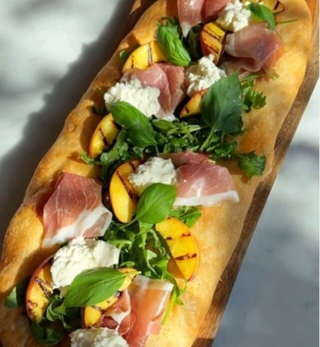 Close-up of Flatbread with prosciutto and peaches