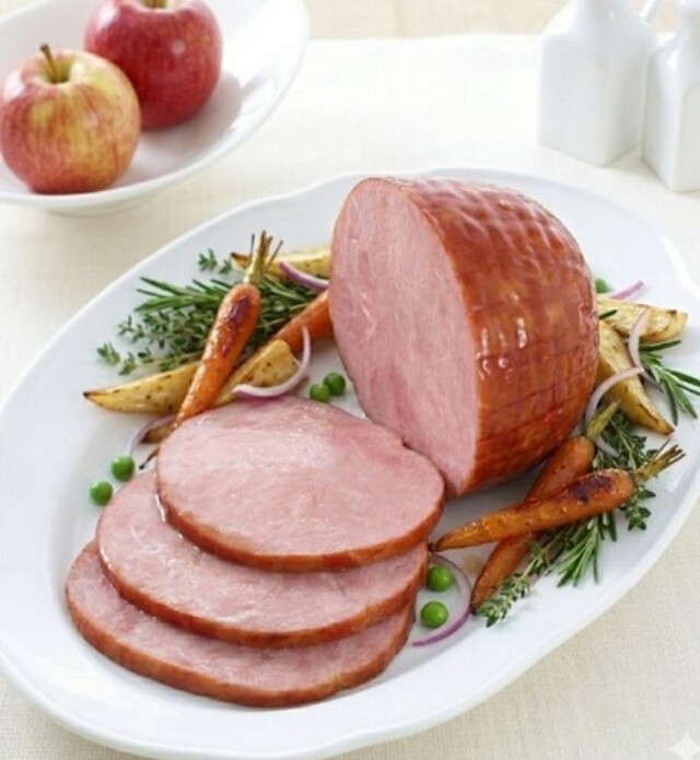 Close-up a dinner ham with carrots