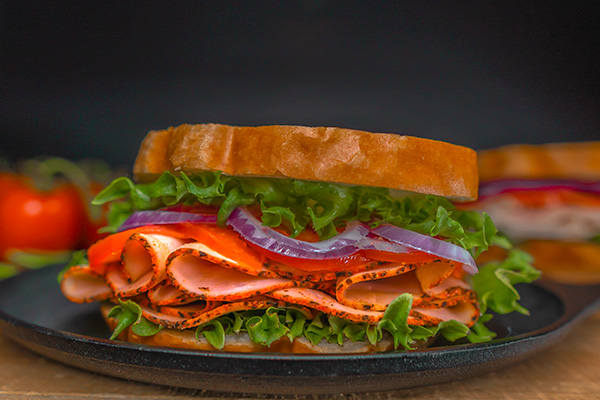 Image of a sandwich made with McLean Meats sliced turkey